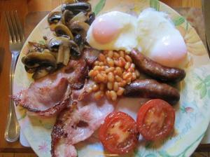 Seriously... who eats beans for breakfast? I mean, come on! Where's the oranges and muffins? And don't even get me started on the tomatoes and mushrooms. 